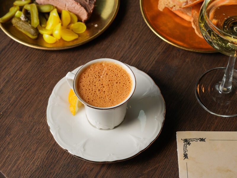 Coffee, pate and toasted bread on golden plates