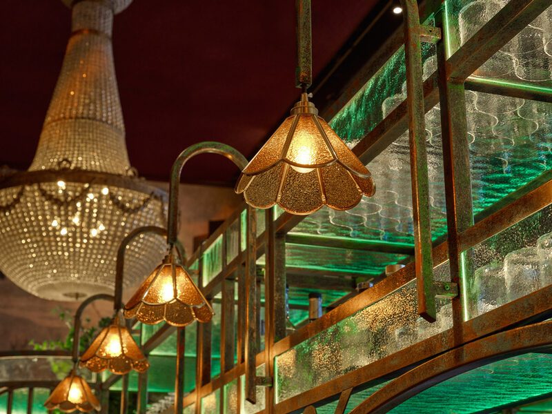 Art nouveau balustrade with amber lamps and chandelier